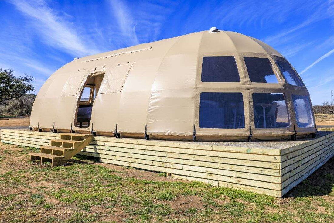Alt text: &quot;Spacious geodesic dome with porthole windows on a wooden platform, ideal for glamping or a luxury Airbnb experience. This large dome tent offers a stylish and sustainable living solution, perfect for a backyard dome or geodesic home setup.&quot;